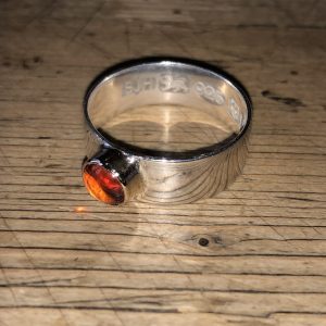 Silver ring set with amber