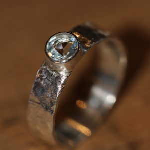 Silver hammered ring set with an Aquamarine gemstone